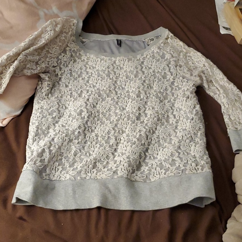 White lace on a gray sweatshirt
